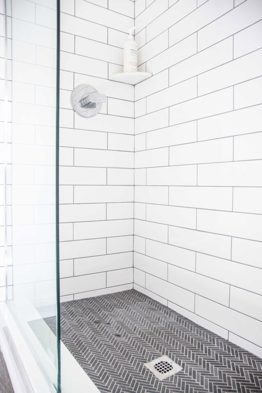 Charcoal Herringbone Shower Floor Tile with White Subway Walls