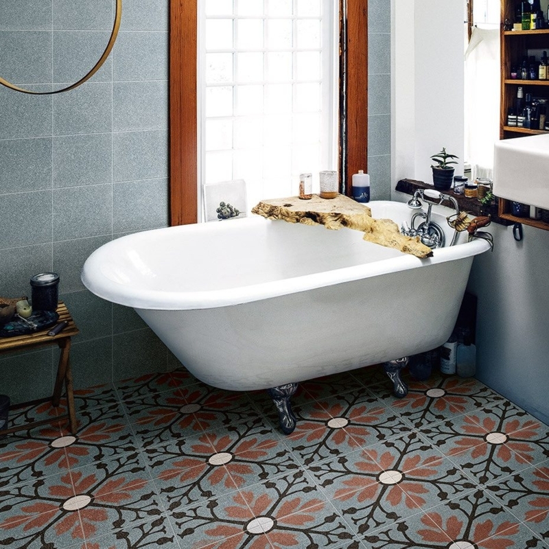 Clawfoot Bathtub in Eclectic Bathroom with Floral Tile Floor