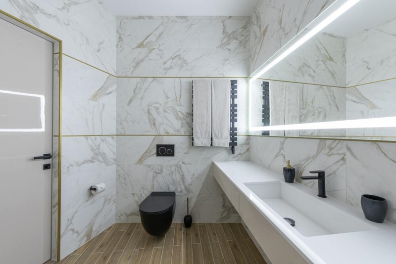 Contemporary Luxury Bathroom Black Toilet Gold Tile Inlays