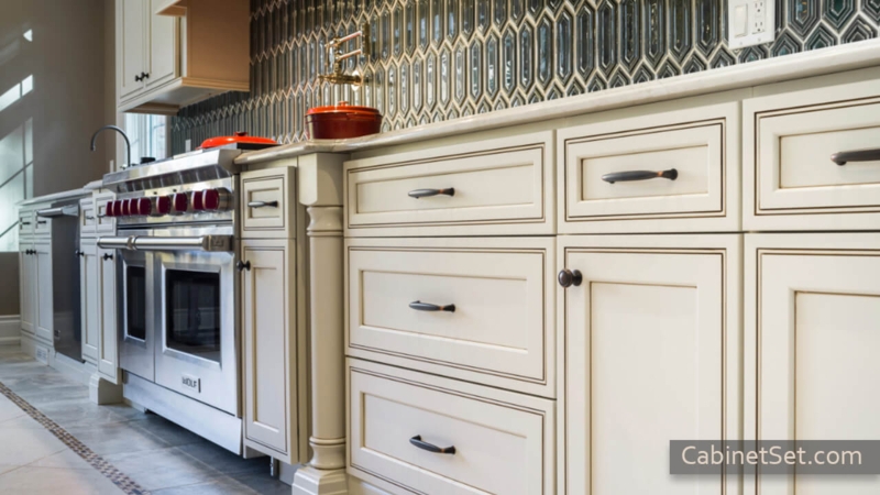 Cream Kitchen Cabinets with Dark Glaze and Geometric Tile (66 characters)