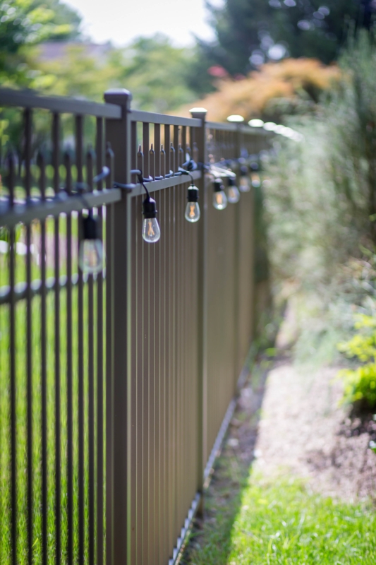 Dark Bronze Metal Fence featuring Cozy String Lights