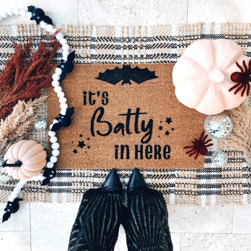 Doormat "It's Batty" Text Bat Motif Layered on Checkered Rug Whimsical