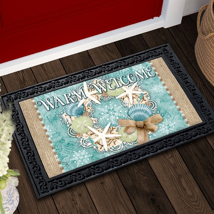 Doormat with Coastal Christmas Theme and Black Scrolling Frame.