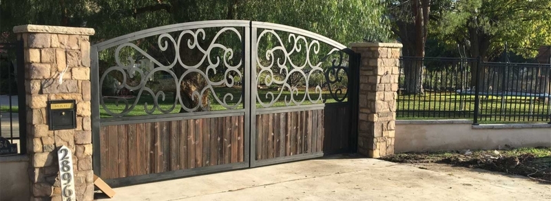 Driveway Gate Mixed Material Wood Arched Metal Scrollwork Rustic Entry