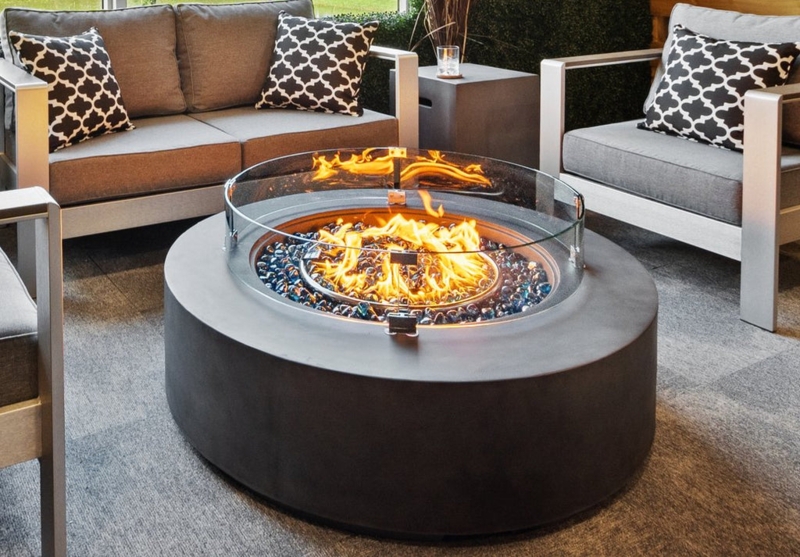 Fire Pit Table Round Monolithic Base Charcoal Blue Fire Glass