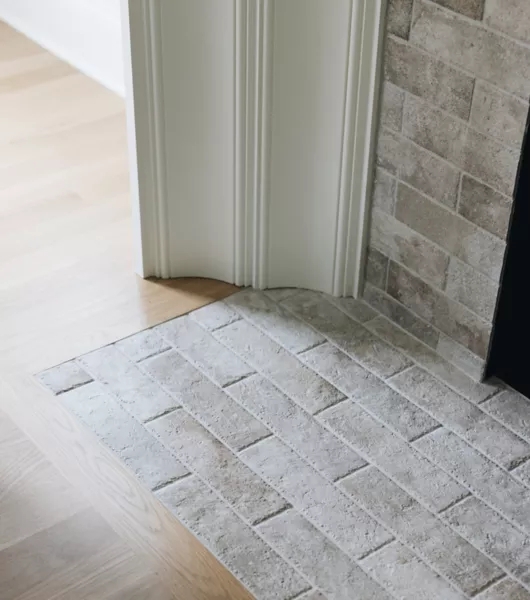 Fireplace Tile: Rough Stone Hearth with Curved White Molding