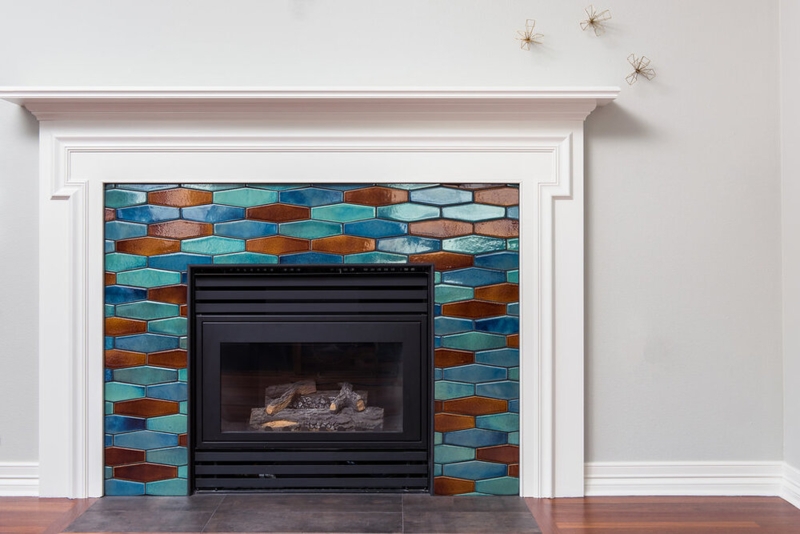 Fireplace: Vibrant Teal and Amber Elongated Hexagon Tile Surround