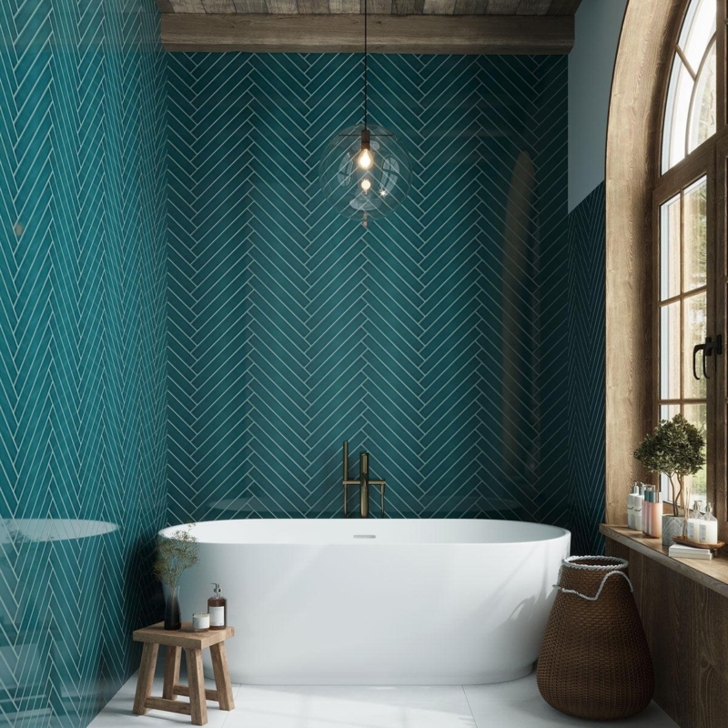 Freestanding Bathtub with Teal Chevron Tile Wall and Arched Window