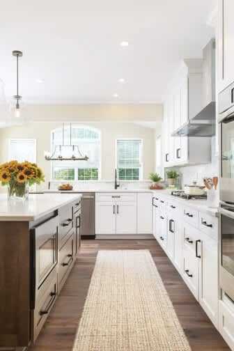 Galley Kitchen Layout with Dark Wood Island and Neutral Woven Runner Rug