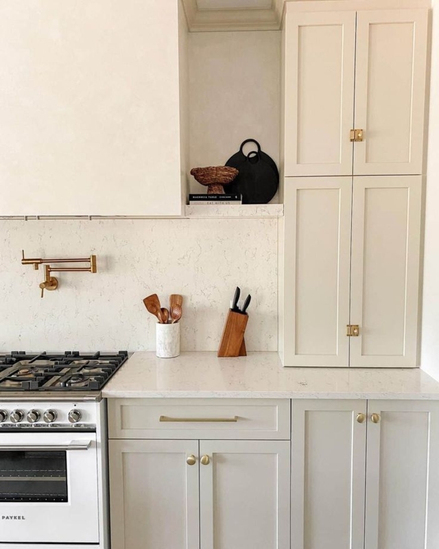 Gold Latch Hardware on Cream Shaker Kitchen Cabinetry (63 characters)
