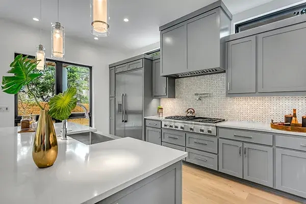 Gray Shaker Kitchen Cabinets with Mosaic Backsplash & Island