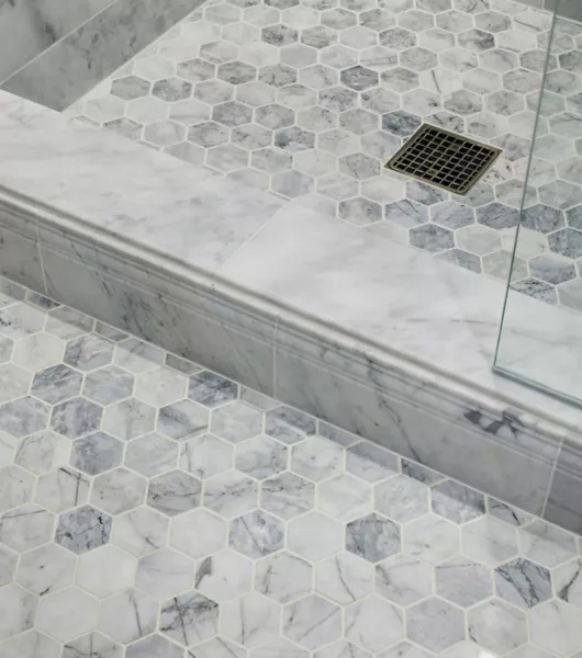 Hexagonal Marble Floor Tile with Matching Stone Shower Curb