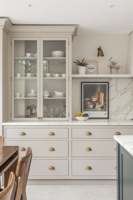 Kitchen Cabinets with Brass Cup Pulls and Glass Hutch (63 characters)