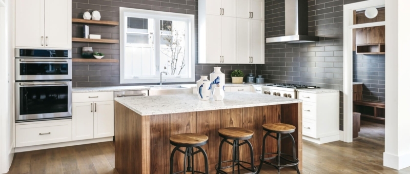 Kitchen with Dark Grey Subway Tile Backsplash and Wood Island Contrast