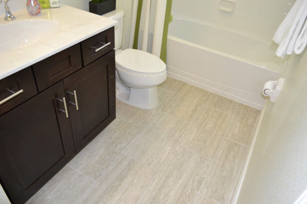 Large Format Tile Bathroom: Stone-Look Matte Finish & Dark Vanity