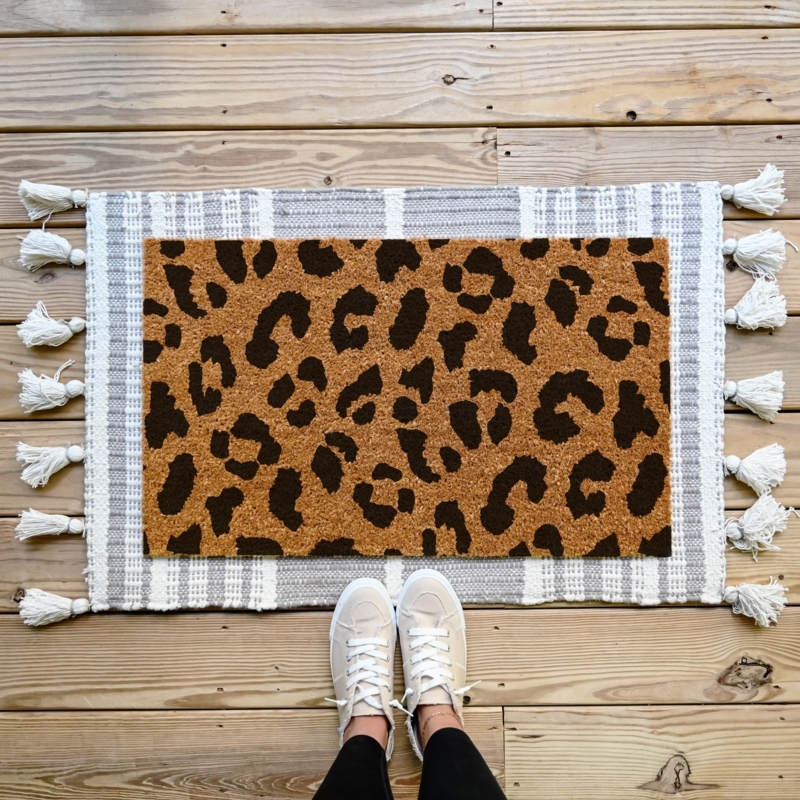 Layered Bohemian Doormat Over Tasseled Rug