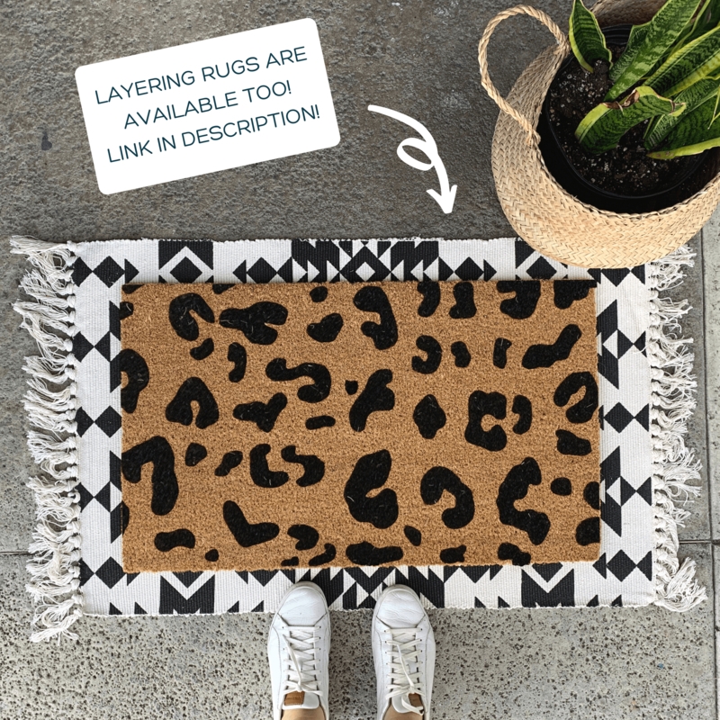 Layered Leopard Print Doormat over Geometric Rug