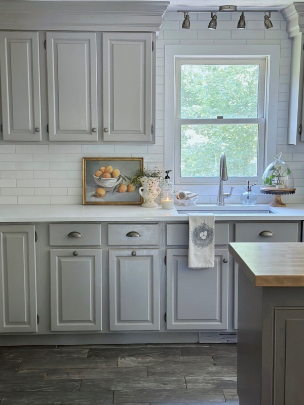 Light Gray Recessed Panel Kitchen Cabinets with Track Lighting