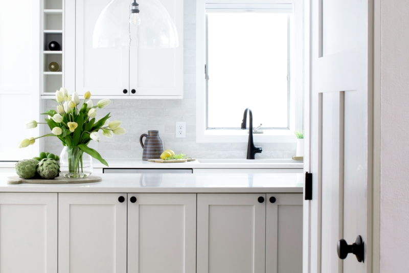 Matte Black Gooseneck Faucet in White Shaker Kitchen with Subway Tile