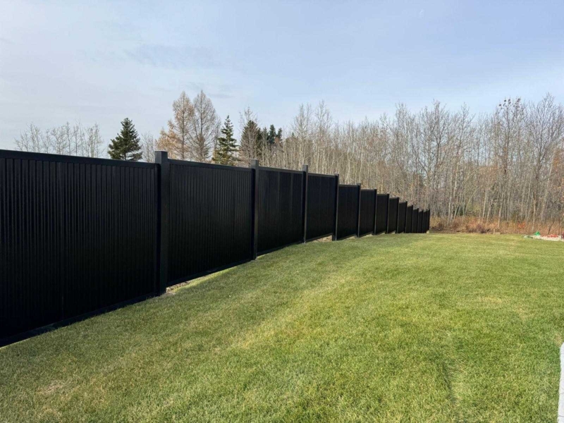Metal Privacy Fence with Stepped Installation for Sloped Terrain