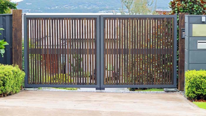 Modern Driveway Gate with Mixed Material Vertical Slats