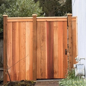 Modern Privacy Fence with Multi Toned Vertical Wood Planks