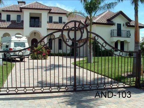 Ornate Arched Driveway Gate with Circular Medallion and Diamond Rail