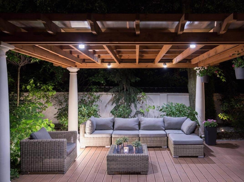 Outdoor Seating Group Woven Rattan Look under Lit Pergola