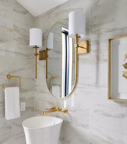 Oval Wall Mirror with Wall Sconces: Marble Look Tiles & Gold Hardware