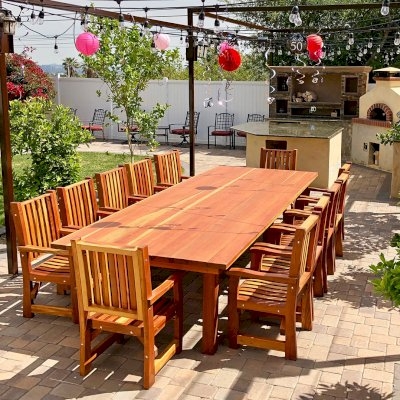 Oversized Outdoor Dining Set with Slatted Armchairs and Warm Wood Tones