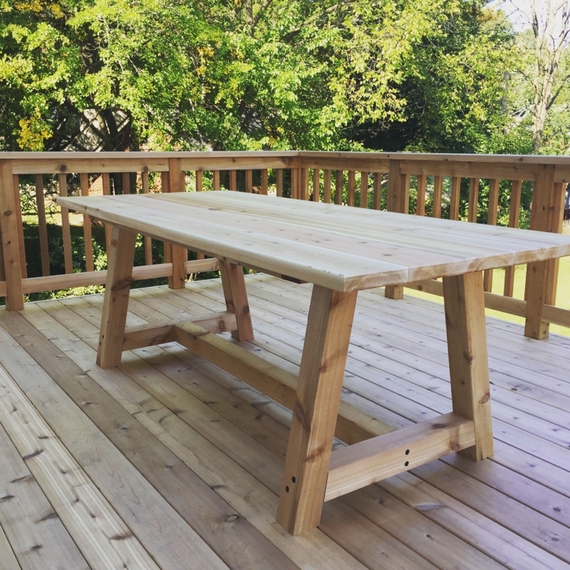 Patio Dining Table with Minimalist Wood Trestle Base and Planked Top