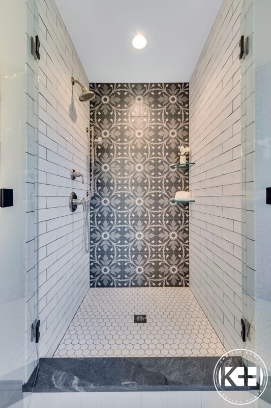Patterned Shower Accent Wall with White Hex Floor Tile
