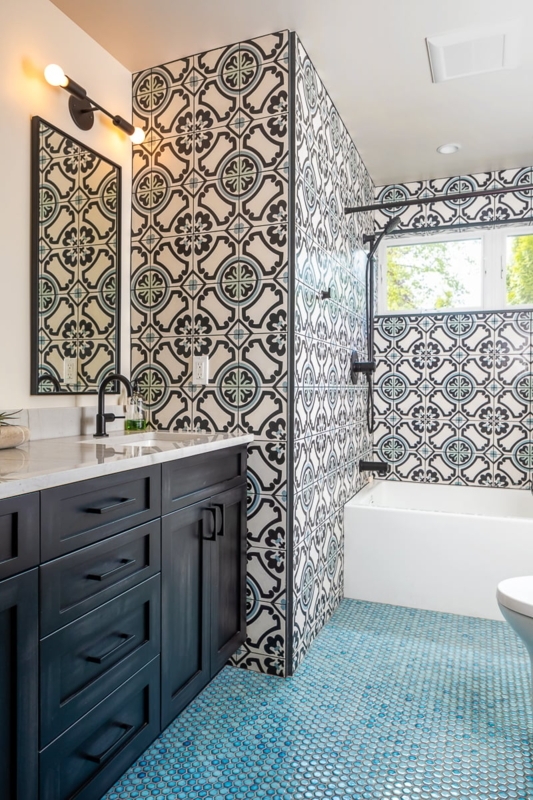 Patterned Wall Tile Bathroom with Blue Penny Floor and Navy Vanity
