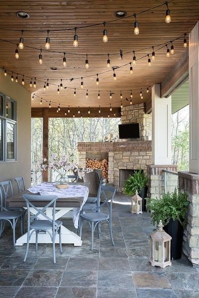 Porch Lighting Ideas featuring Rustic Stone Fireplace