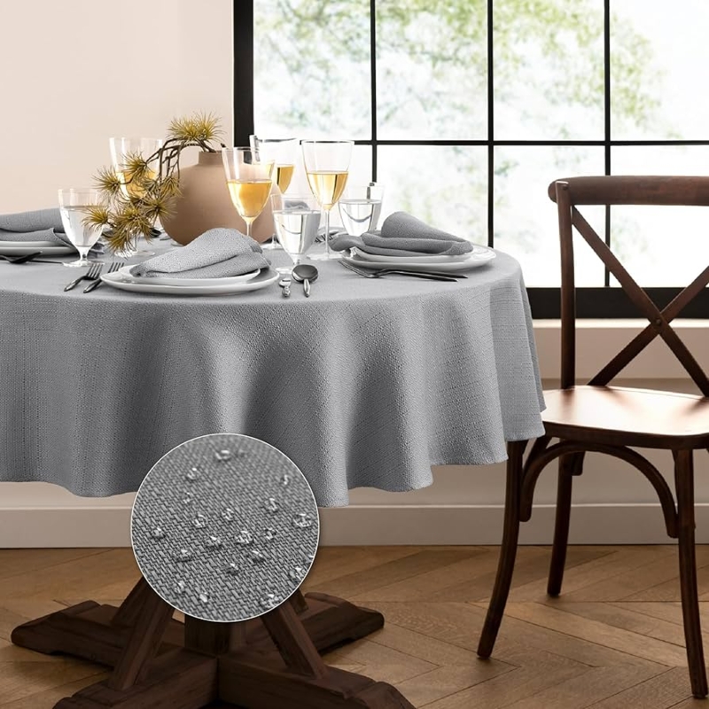 Round Water Resistant Tablecloth in Heathered Gray Woven Texture.