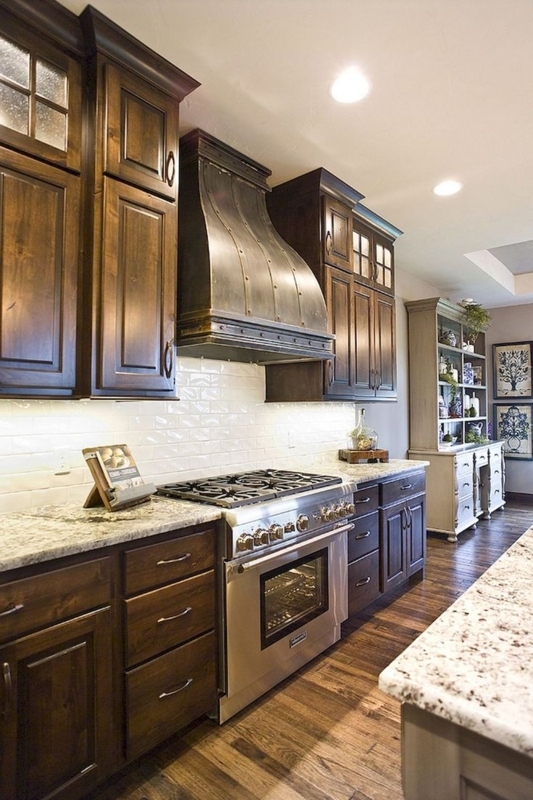 Rustic Traditional Kitchen: Dark Wood Cabinets, Riveted Metal Hood
