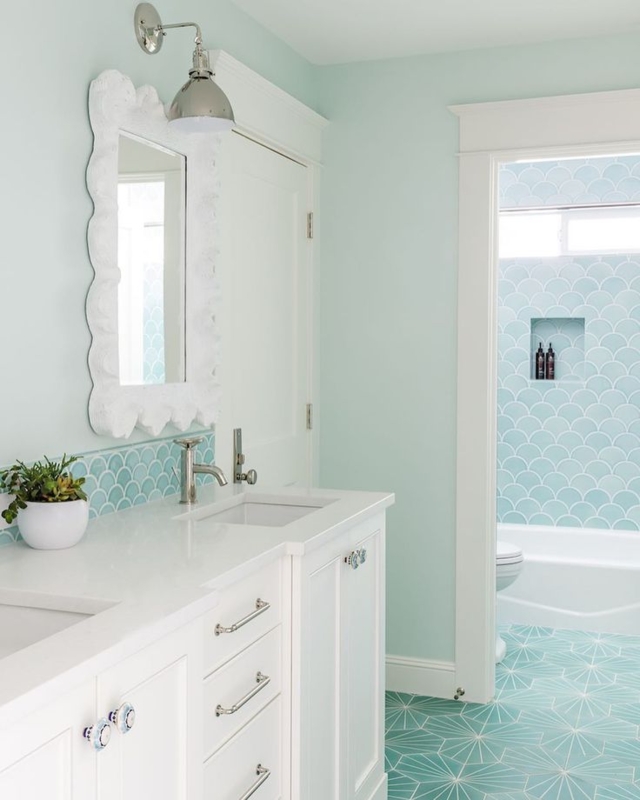 Scallop Tile Backsplash: Geometric Cement Floor White Vanity Coastal Modern