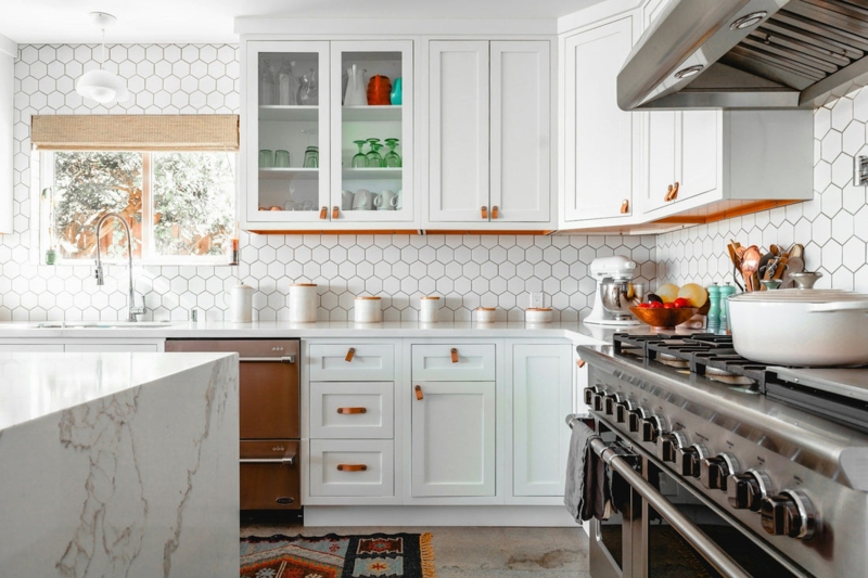 Shaker Kitchen with Tan Leather Pulls and Hexagon Tile Backsplash