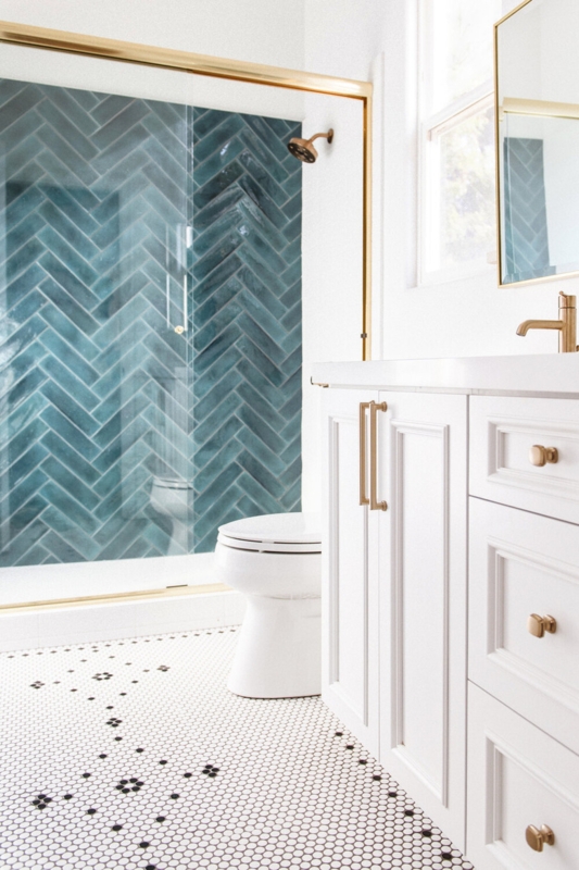 Shower Wall Tiles Teal Herringbone Layout with Gold Fixtures