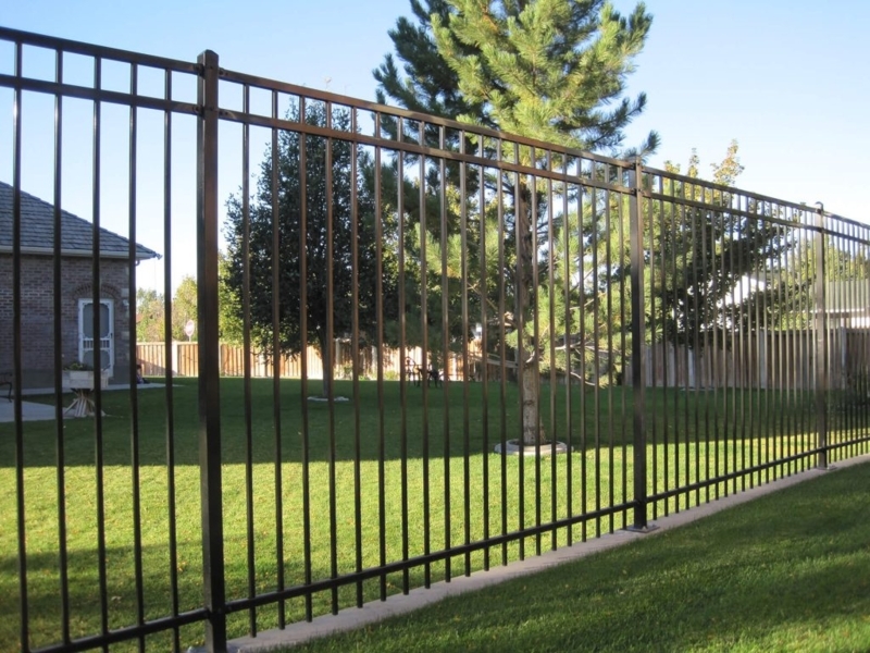 Steel Picket Fence installed on Concrete Curb Base