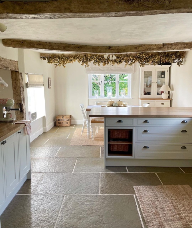 Stone Floor Tiles in Rustic Kitchen with Exposed Ceiling Beams
