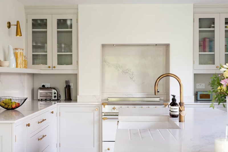 Traditional Kitchen with Ribbed Glass Cabinets and Gold Bridge Faucet