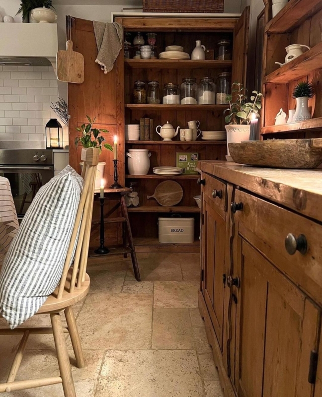 Tumbled Stone Floor in Cozy Kitchen Pantry with Antique Wood Hutch