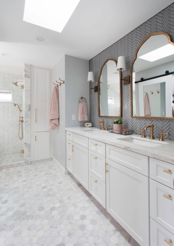 Vanity with Gray Herringbone Backsplash & Arched Mirrors