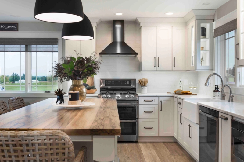 White Shaker Cabinets with Black Hardware and Natural Wood Island Top