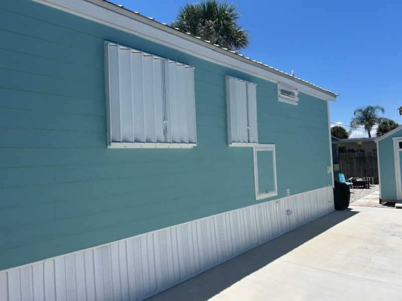Accordion Shutters: White Folding Aluminum for Hurricane Protection
