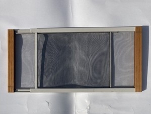 Adjustable Window Screen with Wood-Toned Ends and Expandable Frame