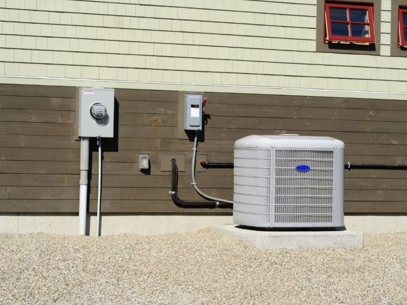 Air Conditioner Condenser Unit on Concrete Pad Outdoor Installation