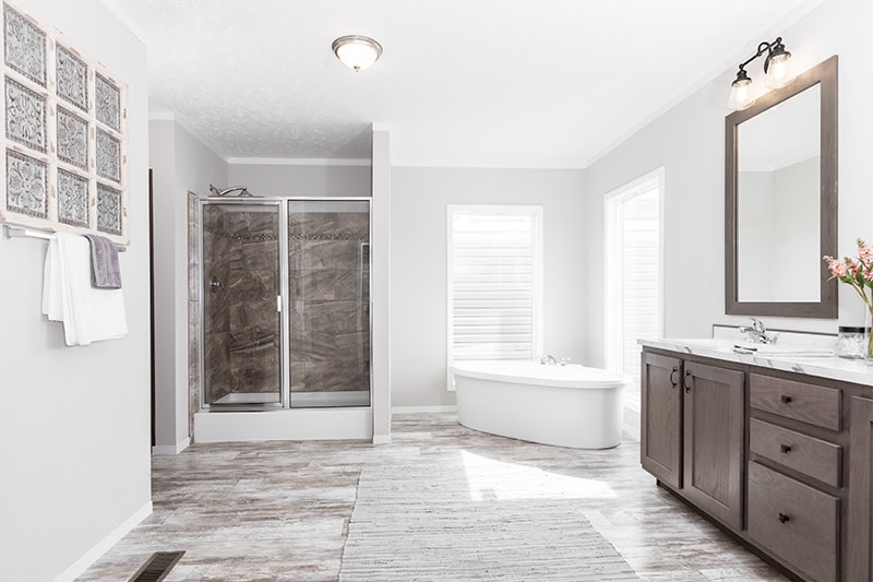 Airy Bathroom Layout: Freestanding Oval Tub & Glass Shower