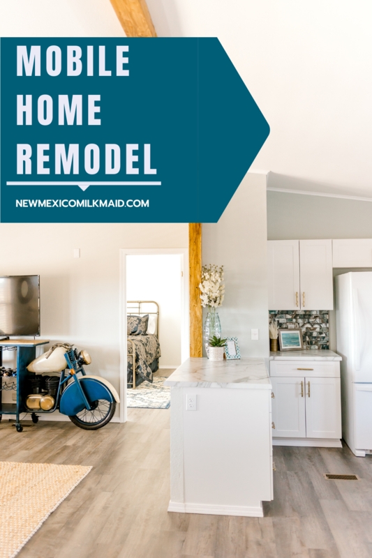 Airy Mobile Home Kitchen: White Shaker Cabinets & Natural Wood Beam